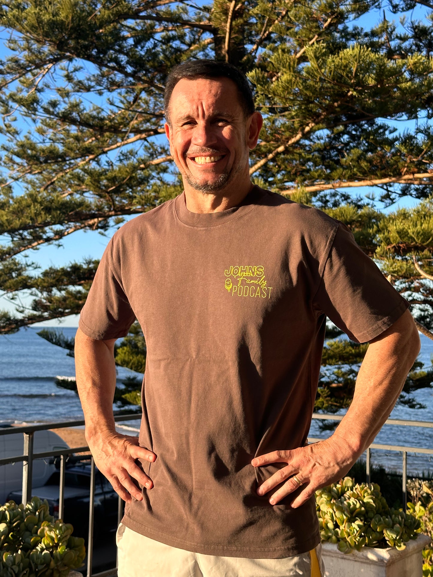 Faded Brown Johns Family Podcast Logo Tee |